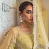 The love we share will make her mehndi day super duper amazing. This mehndi wears an olive front open shirt which is laboriously hand-rendered with a silver embroidery involving tilla, dabka, kora and Sitara. Further, the sweetheart shape neckline fulfils the dreamy look of the bride when comes with cape sleeves. The following shirt of mehndi wear is systemized with crushed sharara which is so simple and unique. Finishing this mehndi wear with a pleated dupatta that is maintaining a balance between outfits.