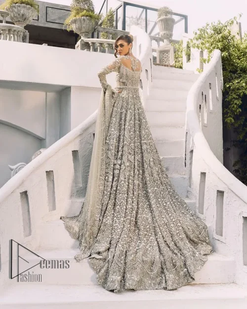 It was love at first swipe! Presenting this olive green back train maxi which is laboriously hand-rendered with silver and