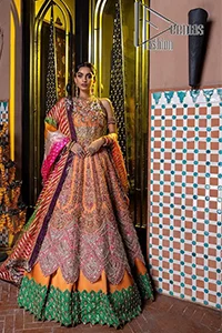 In a world full of trends, sometimes a bride just wants to wear something classic and traditional. In this way, DeemasFashion presents the major Pakistani walima dress which is nearest to the traditional style. The Pakistani walima dress starts from the orange pishwas which is beautifully styled with an illusion neckline and sleeveless. Further, it is enhanced with colourful embroidery which includes kora, dabka, tilla and Sitara to make your day super special. Pakistani walima dress is systemized with lehenga in the same colour but has a heavy green border to add beauty to the dress. Complete this Pakistani walima dress with a colourful dupatta to meet the following traditional trend.