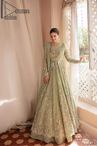 A time of life that is not just an occasion but a celebration. A pastel green scalloped maxi laboriously frosted with meticulously detailed hand embellished with silver tilla, dabka, and kora work blooming all over. Further, the jewel neckline and full sleeves of this article give so soothing feeling to you your walima day. Walima dress is handsomely coordinated with a pastel green lehenga that is again beautifully embellished. Complete this walima dress with the organza dupatta in the same colour, heavily laden with a four-sided border and tiny floral motifs all over with a magical stream of pearls.