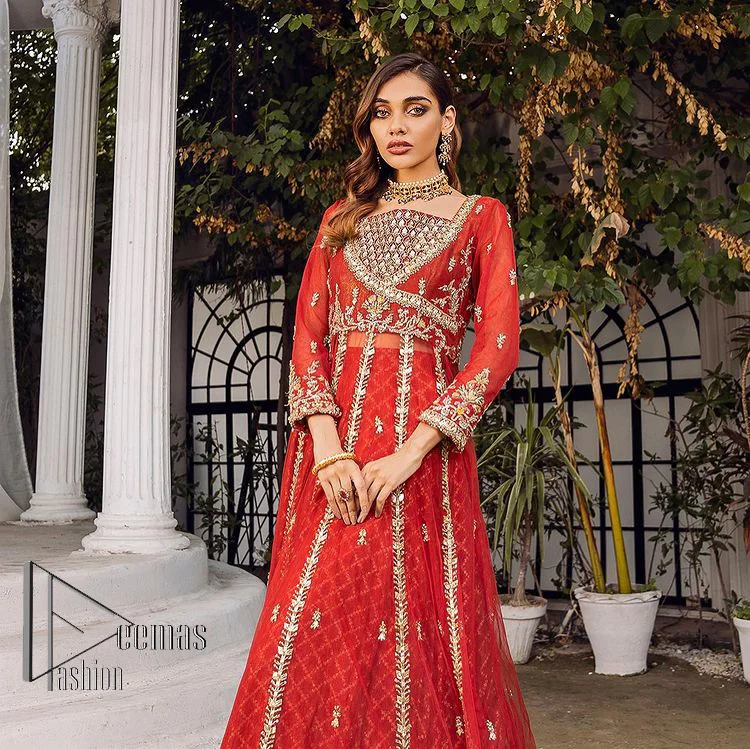 There is a shade of red in every mehndi wear. So, DeemasFashion presents this mehndi wear in the red shade which is handsomely ornamented with light golden embroidery and enhanced with tilla, dabka, kora and Zardozi. The square neckline adds more beauty to the outfit when comes with three-quarter sleeves. It is exquisitely combined with a red lehenga to make your mehndi more remarkable. Finish this mehndi wear with a dupatta in the rust colour which border is embellished with a four-sided Kiran and sequins spray all over to put amazing shade on your Mehndi.