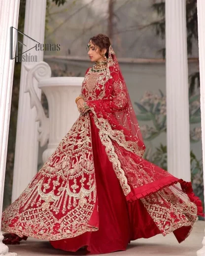 Marry someone who makes your heart shine. Wear what makes your soul shine. Introducing this Pakistani reception outfit which begins with a red blouse which is laboriously hand-rendered with silver embroidery to make your day super bright as silver colour. Further, it is highlighted with tilla, dabka, kora and crystal. The blouse of this Pakistani reception outfit is enhanced with boat shape neckline and three-quarter sleeves. The following blouse of the Pakistani reception outfit is systemized with a panelled lehenga in the same colour which is again heavily embellished. Complete this outfit with a frilled dupatta which is embellished with two-sided borders and sequins sprayed all over to make you shine.