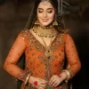 A colourful mehndi outfit is a power which directly influences the soul. Begin this mehndi outfit with a rusted front open shirt which is beautifully decorated with colourful embroidery to give you more power on your mehndi day. It is prominent with tilla, dabka, kora and zardozi. Further, the V shape neckline adds to this mehndi outfit when comes with full sleeves. Paired with a green lehenga having multiple colour borders to give you a more traditional look also. Complete this mehndi outfit with a colourful dupatta which is adorned with four-sided borders and sequins sprayed all over.