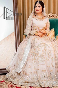 Confidence is wearing white on the big day. DeemasFashion presents the handsome and most attractive nikah outfit in white colour. Begin this nikah outfit with flared maxi which is beautifully decorated with light golden and silver embroidery involving kora, dabka, tilla and crystal to make your nikkah outfit super amazing. The round neckline of the nikah outfit laboriously comes with full sleeves. It is paired up with a dupatta in the same colour having a four-sided embellished border and sequin sprayed all over to increase your confidence with this nikah outfit.