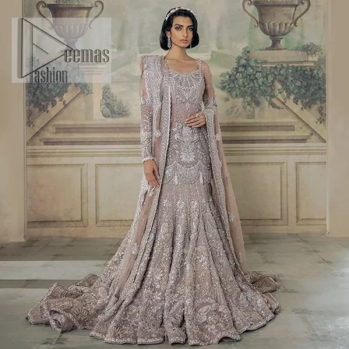 Luxurious canvas embodying grace and style! It is a well-crafted short shirt enhanced with silver embroidery accentuated with gleaming ornaments.