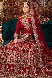 Deep Red Blouse - Fit And Flare Lehenga. The article also includes a fit and flare lehenga with heavy embroidery in a light golden colour to make your day more romantic. Complete this article with a deep red dupatta adorned with a four-sided border to give you the flavour shade of a bride.