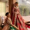 A combination of red and green are here to win hearts at your Mehndi. The attractive lehenga in green colour is hand-rendered with golden embroidery and enhanced with tilla, dabka, kora and zardozi. The floral pattern of the lehenga is followed by attractive border embroidery. It is paired up with a red blouse choli which is beautifully embellished and enhanced with V shape neckline. Further, the half sleeves style of the blouse also added beauty to this outfit. Finish this outfit with a dupatta which is ornamented with four-sided borders and floral motifs all over.