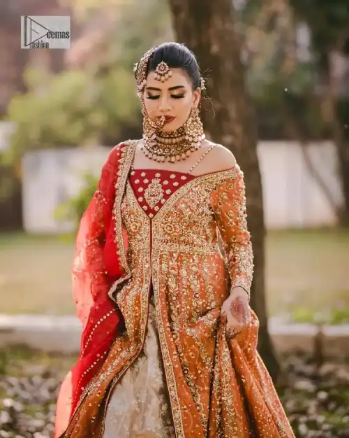 Shine bright in the sparkling ensemble from DeemasFashion. Introducing this reception outfit which begins with a rust pishwas.  This front