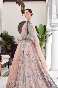 When you asked for it, we heard it. This sea green hued blouse has multiple colour embroidered details of tilla,dabka, kora, zari and sequin. It has a sweetheart neck and full sleeves style for gaining full attractiveness on your Nikah. The following blouse is organized with tea rose lehenga which is heavily embellished to make this masterpiece more aesthetic and cool.  Complete this article with a dupatta which is adorned with a four-sided embellished border. Further, it is enhanced with a sequin spray that you actually want for your big day.
