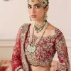 This outfit is a stand-out look for the Pakistani reception, this ensemble consists of a bright red-hued lehenga choli. This light golden embroidery is done with dense handsome work with the detailing of tilla, dabka, kora, zardozi and stone. The boat shape neckline of the following scalloped blouse intensifies the overall beauty of the outfit. Further, the beautiful floral patterns on three-quarter sleeves make this blouse super charming and ten times attractive. It is teamed up with can-can lehenga in the same colour that is ideal for the brides who want to be a queen on her Bug day. The outfit is paired with a dupatta heavily embellished all around the border, with a centre spray of sequins.