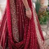 Keep it dreamy and classic with the best DeemasFashion reception wear! The handsome deep red outfit with blouse and lehenga is gracefully embellished with silver embroidery that gives you a head-turning appearance on the wedding day. The blouse is enhanced with tilla, dabka, kora, Kundan and crystals. The round neckline of the blouse makes this glamorous attire an epitome of royalty and grace. Luxury designs on half sleeves add super beauty to the outfit. It is organized with a lehenga adorned with embroidery to make your day charming. Finish this outfit with a dupatta embellished with four-sided borders and which is sprinkled with sequins all over.