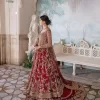 Bright and blissful! This ensemble is the epitome of grace.  The maxi is fully emblazoned with tilla, dabka, kora, Kundan and details of Zardozi. Intricate designs and fine details of golden embroidery give a perfect finishing look to the blouse. Further, embellishment full sleeves give a stunning touch to the blouse. The following blouse is further enhanced with V shape neckline. It is paired up with a lehenga that is ornamented with beautiful embroidery. The Lehenga has a huge flare and long tail. The outfit achieves the final ravishing look when paired with a delicate dupatta. The borders of this dupatta are hand-embellished and decorated with sequins sprayed.