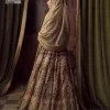 This alluring outfit is surely any girl’s dream. The hazel blouse is a magnificent choice which is ornamented with golden embroidery that wins everyone's hearts at the very first glance. It is further intensified with tilla, dabka, kora, Kundan and stones. Hand-crafted details on the full sleeves of this beautiful nikah dress make it the epitome of beauty. It is coordinated with a lehenga which is decorated with the finest details that are your first priority for the wedding. The lehenga has a huge flare to fulfil the dreamy look. Complete this article with a dupatta that is adorned with four-sided embellished borders and sparkling sequins to make your day.