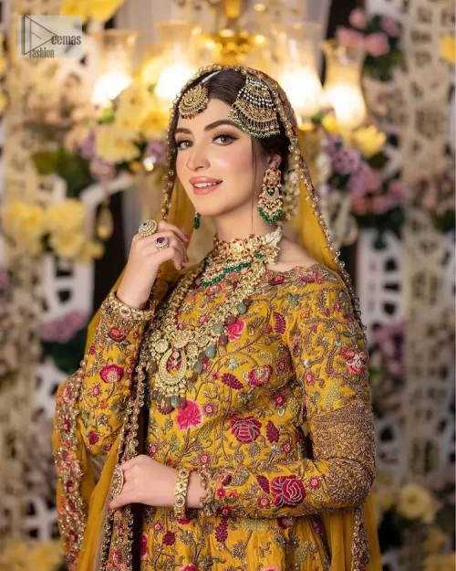 Take your style quotient up a few notches in this exquisite mehndi outfit! ]The maxi in mustard colour is a