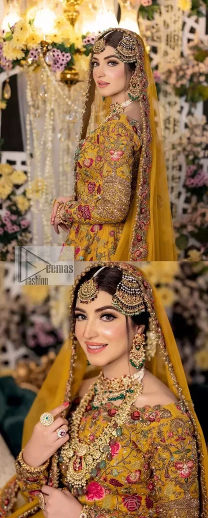 Take your style quotient up a few notches in this exquisite mehndi outfit! ]The maxi in mustard colour is a ravishing bridal attire with a magnificent elite and classy appearance. Gorgeous and glamorous multiple-colour embroideries enhance the showiness of this maxi.  It is further intensified with tilla, dabka, kora, Kundan and details of thread embroidery. Full sleeves, boat shape neckline and sparkling work make it a perfect traditional wear. It is coordinated with a scalloped dupatta in the same colour which is embellished with four-sided borders and floral motifs all over to make this outfit unique and aesthetic.