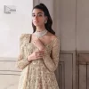 Ooze beauty and elegance in this simple yet amazing ensemble. This walima outfit in the off-white colour is a  magnificent look emblazoned with beautiful light golden embroidery which is further enhanced with tilla, dabka, kora, Kundan and the real magic of thread. The square neckline and full sleeves are unique in style and have classy look and perfect choice for the traditional bride. It is paired up with a lehenga which is adorned with beautiful embroidery. Father, the lehenga has a back-train to make this outfit lovely. Complete this with a dupatta framed with four-sided borders and sequins sprayed all over to add extra glam to this masterpiece.