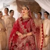 Enter the world of allurement with red shade, a gorgeous go-to dress for your big day to make you look classy and fabulous at the same time! A red organza base reception outfit is generously light golden embroidered with tilla, dabka, kora, Kundan and resham to form a beautifully composed lehenga, maxi and dupatta. The round neckline, three quarter sleeves make this outfit super amazing and charming. It is paired up with lehenga which is adorned with ting floral motifs. The can-can make this lehenga a dreamy real magic. Finish this look with dupatta, framed with a four sided borders. It is enhanced with sparkling of tiny floral motifs and sequins spray.