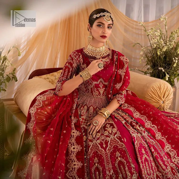 Enter the world of allurement with red shade, a gorgeous go-to dress for your big day to make you look classy and fabulous at the same time! A red organza base reception outfit is generously light golden embroidered with tilla, dabka, kora, Kundan and resham to form a beautifully composed lehenga, maxi and dupatta. The round neckline, three quarter sleeves make this outfit super amazing and charming. It is paired up with lehenga which is adorned with ting floral motifs. The can-can make this lehenga a dreamy real magic. Finish this look with dupatta, framed with a four sided borders. It is enhanced with sparkling of tiny floral motifs and sequins spray.
