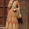 Let your dreams be your wings as your mehndi outfit. This rust heavy maxi features thoughtfully placed bold motifs all over and each motif is crafted using tilla, dabka, koran, Resham and Zardozi techniques. It is further enhanced with golden embroidery. The V shape neckline adds more beauty to the outfit when comes with embellished full sleeves. The beautiful outfit achieves the final ravishing look when paired with a delicate dupatta. The borders of this dupatta are heavily adorned with embroidery that gives a slaying touch to the whole attire.