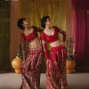 We are Introducing a wine red blouse and lehenga to our wide range of charming bridal dresses. The Pakistani reception Lehenga is an amalgamation of contemporary and traditional art which is decorated with golden embroidery. The embroidery is further enhanced with tilla, dabka, kora, Kundan and detailing of zardozi. It is paired up with a wine red blouse which is adorned with tiny floral motifs. The full sleeves of the blouse are heavily embellished to increase the beauty of the outfit. Further, the square neckline makes this blouse a unique masterpiece. Finish this with a dupatta with a four-sided embellished border and floral motifs all over.