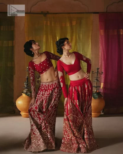 We are Introducing a wine red blouse and lehenga to our wide range of charming bridal dresses. The Pakistani reception Lehenga is an amalgamation of contemporary and traditional art which is decorated with golden embroidery. The embroidery is further enhanced with tilla, dabka, kora, Kundan and detailing of zardozi. It is paired up with a wine red blouse which is adorned with tiny floral motifs. The full sleeves of the blouse are heavily embellished to increase the beauty of the outfit. Further, the square neckline makes this blouse a unique masterpiece. Finish this with a dupatta with a four-sided embellished border and floral motifs all over.