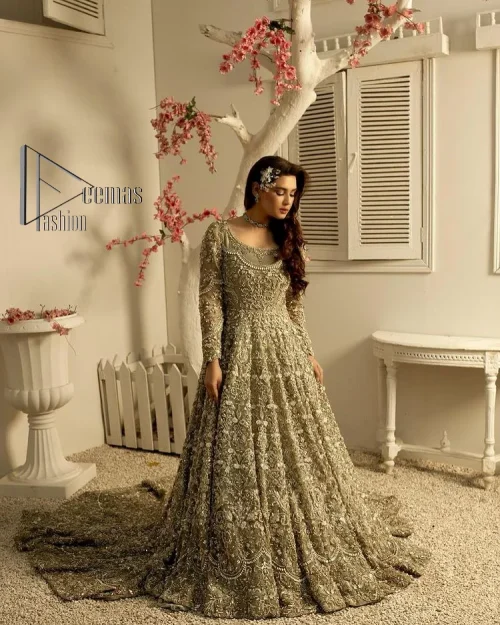 It was love at first swipe! Present this olive green back train maxi which is laboriously hand-rendered with silver embroidery