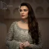 It was love at first swipe! Present this olive green back train maxi which is laboriously hand-rendered with silver embroidery to make you a pure soulful bride. It is enhanced with tilla, dabka, kora and Kundan. The illusion neckline adds more beauty to this walima wear when comes with full sleeves. The back train flare is made just for you to catch more and more love from your loved ones. Complete this walima wear with a dupatta in the same colour which is handsomely embellished with a four-sided heavy border and sequins sprayed all over to receive more love.