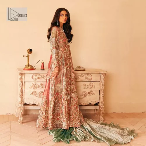 The latest elegant embroidered maxi in peach colour with magnificence embroidered work. The front open maxi is attractively laden with