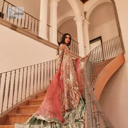 The latest elegant embroidered maxi in peach colour with magnificence embroidered work. The front open maxi is attractively laden with