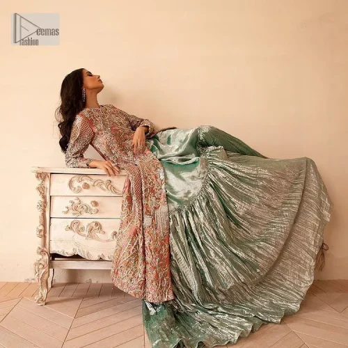 The latest elegant embroidered maxi in peach colour with magnificence embroidered work. The front open maxi is attractively laden with