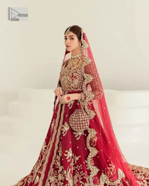 Be a dreamy vision in this reception wear. The beautiful pishwas in the bright red shade is embellished with intricate