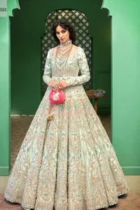 Brighten up your big day with this beautiful ensemble - Perfectly suited to the trend! DeemasFashion presents this nikah wear in the shade of ice blue. This stunning maxi has a fully embellished square neckline and full sleeves. Graceful multiple-colour work and floral designs enhance the charm of this maxi. Zardozi, pearls, dabka, kora, Kundan, and stones give a perfect finish to the overall look. The flares of the following maxi make it your foremost priority to wear on the most important day of your life. Paired this with a dupatta which is adorned with a four sided embellished borders and sequins sprayed all over to make this look more charming and perfect.