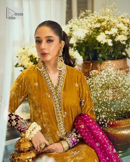 This mustard ensemble features zari and tilla details creating the perfect magical look for the season! The stunning long shirt