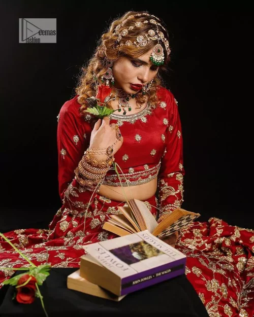 Reception called, and red answered. The stunning blouse is embellished with floral motifs. The base colour used for choli is