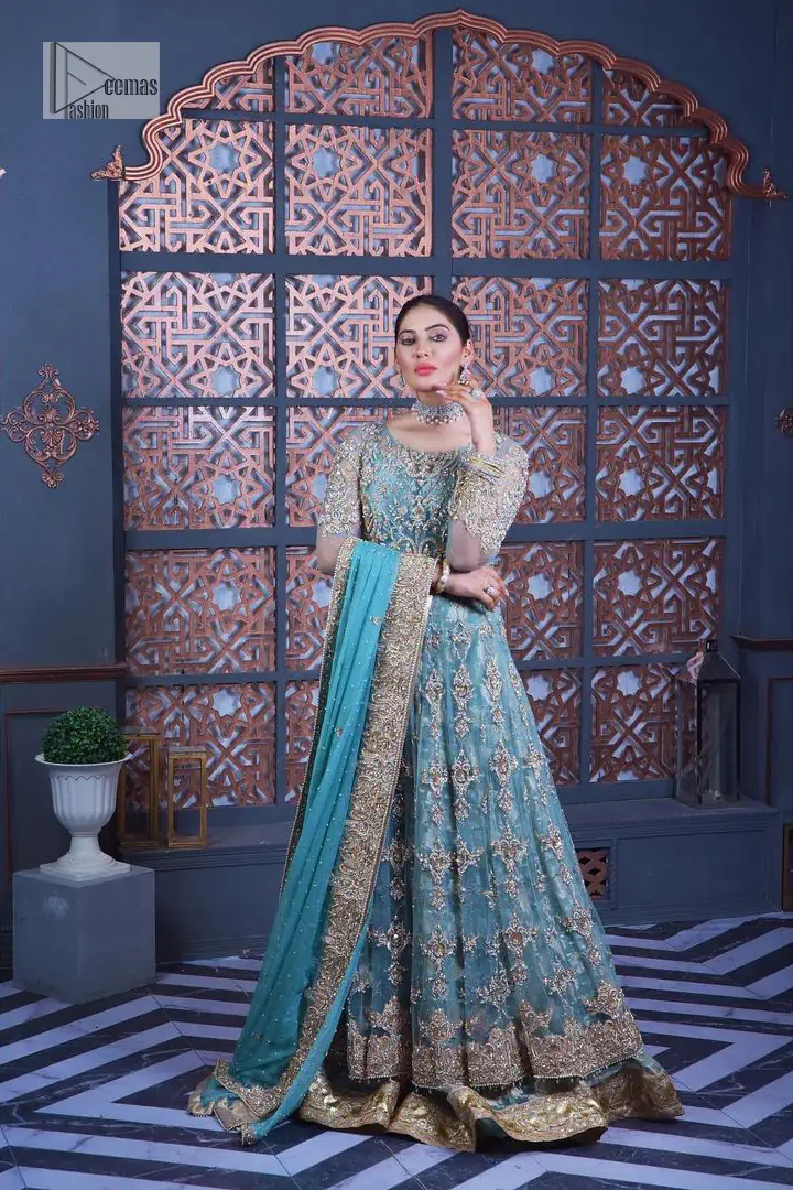 Serving looks we love. DeemasFashion presents this party outfit in sky blue colour which is adorned with silver embroidery and further prominent with tilla, dabka, kora, Kundan, Zardozi and the real magic of crystals. The round neckline looks like a complete diva since it is so opulent and vibrant. Further, the full sleeves make this masterpiece lovely and charming. It is organized with lehenga made with pure jamawar which speaks for itself. Complete this outfit with a dupatta framed with four-sided borders that have been carefully added for the additional finishing touch.
