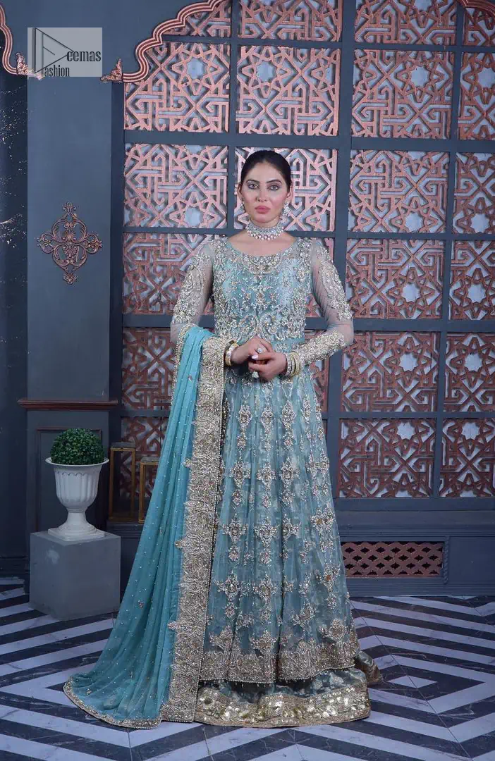 Serving looks we love. DeemasFashion presents this party outfit in sky blue colour which is adorned with silver embroidery and further prominent with tilla, dabka, kora, Kundan, Zardozi and the real magic of crystals. The round neckline looks like a complete diva since it is so opulent and vibrant. Further, the full sleeves make this masterpiece lovely and charming. It is organized with lehenga made with pure jamawar which speaks for itself. Complete this outfit with a dupatta framed with four-sided borders that have been carefully added for the additional finishing touch.