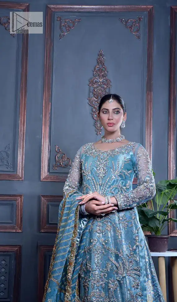 Serving looks we love. DeemasFashion presents this party outfit in sky blue colour which is adorned with silver embroidery and further prominent with tilla, dabka, kora, Kundan, Zardozi and the real magic of crystals. The round neckline looks like a complete diva since it is so opulent and vibrant. Further, the full sleeves make this masterpiece lovely and charming. It is organized with lehenga made with pure jamawar which speaks for itself. Complete this outfit with a dupatta framed with four-sided borders that have been carefully added for the additional finishing touch.