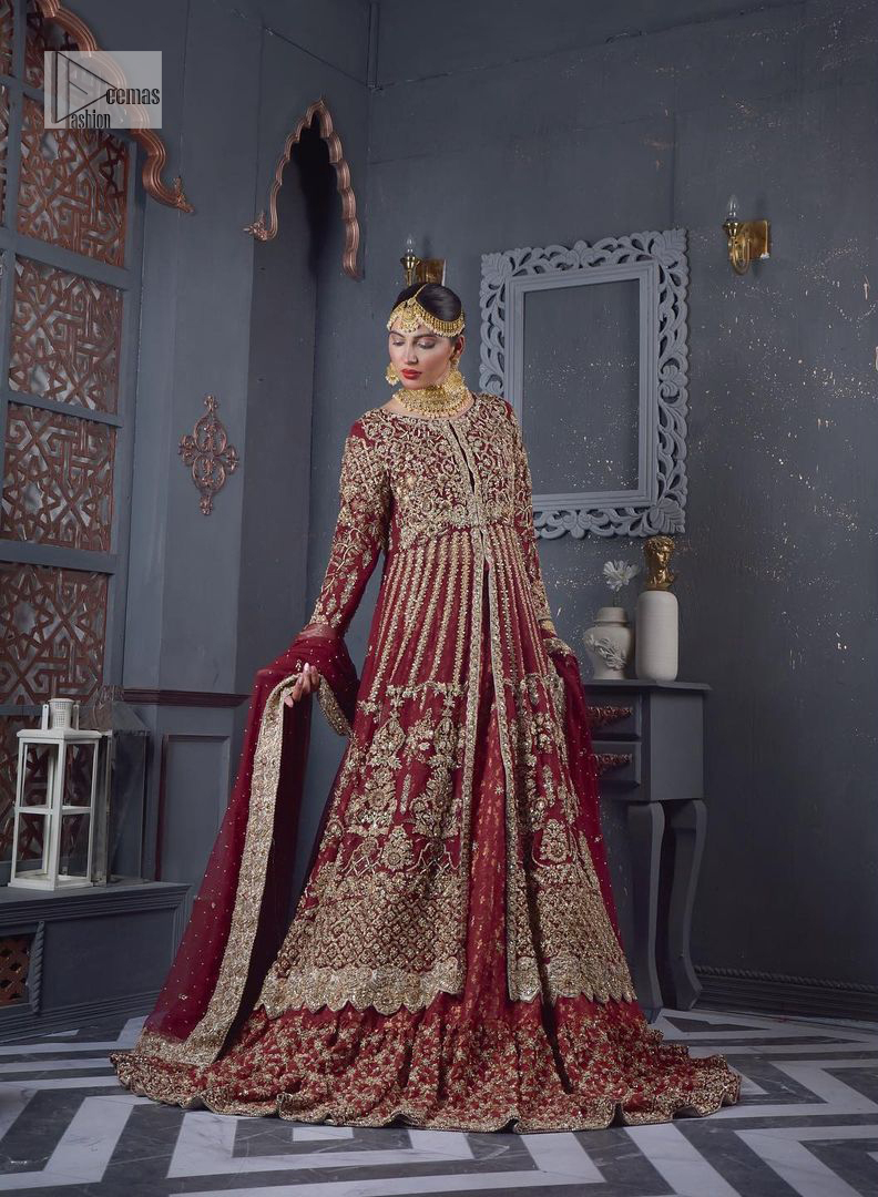 Bold and classy colour for the reception outfit! The maroon gown is breathtakingly adorned with hand-crafted embellishments and intricate designs. It is enhanced with tilla, dabka, Koran, Kundan and details of Zardozi. The round neckline is emblazoned with golden embroidery to make this masterpiece romantic. The full sleeves of the following scalloped gown are adorned with fine details. It is paired with flared lehenga which is also heavily embellished giving a royal look to the gorgeous bride. Finish this maroon outfit with a dupatta which is ornamented with four-sided borders and sequins sprayed all over to create an exquisite dress.