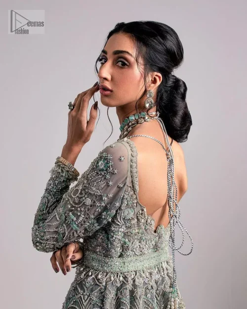 The beautiful mint green reception wear is a breathtaking masterpiece that will give you a magnificent look at the wedding.