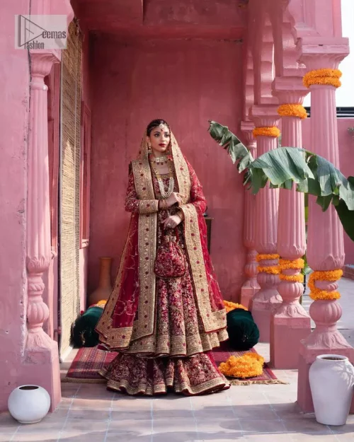 Deep shades of this reception wear just to brighten up your days. The deep red frock is intricately emblazoned with