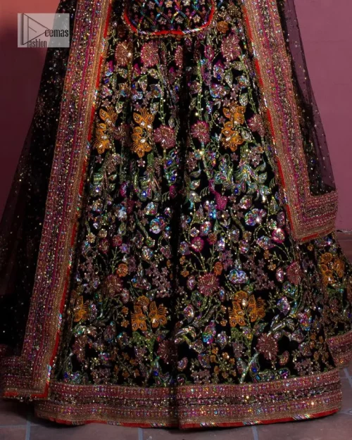 Make your superb days bright and bold! A jet black blouse with floral branches, peacock motifs and Mughal-inspired embellishments with