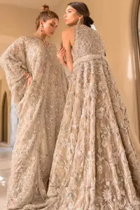Light Fawn Gown – Blouse n Capri Pants Embrace the essence of your Walima celebration with this exceptional outfit coordinated with capri pants and a blouse tailored to reflect your distinct style. Elevate your wedding experience with a dress as unique as your love story.