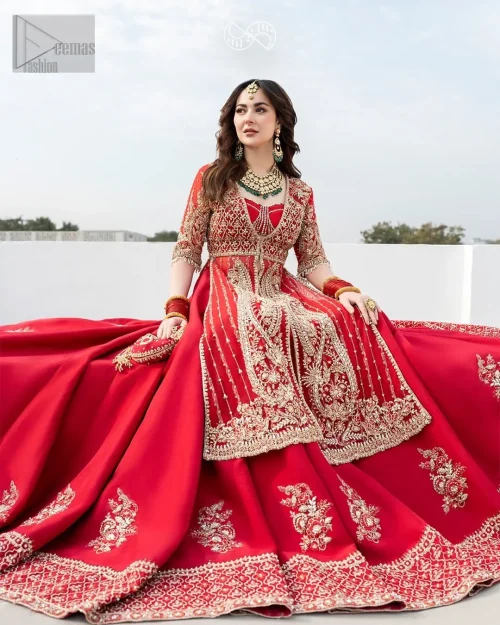 Crafted with meticulous attention to detail, this reception dress exudes elegance and sophistication. It is decorated with golden embroidery which