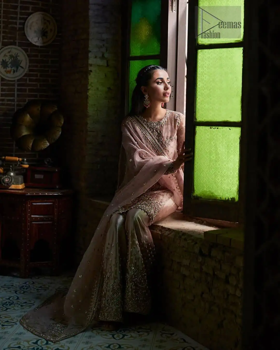 Introducing our Salmon pink Nikah dress, a true embodiment of purity and simplicity for your special ceremony. This elegant ensemble is thoughtfully designed with dark antique shades of embroidery which involves tilla, dabka, Kora, Kundan, and minimalist silhouette, allowing your natural beauty to shine on this sacred occasion.