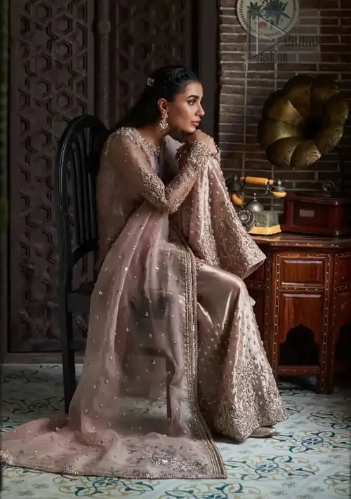 The classic dupatta in the same color symbolizes the essence of the Nikah, while delicate embellishments add a touch of