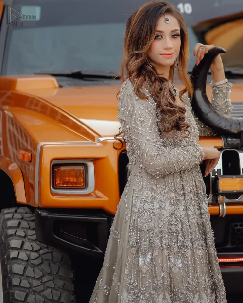 This dress is crafted from luxurious organza, the round neckline completes this divine ensemble, leaving you feeling like royalty on