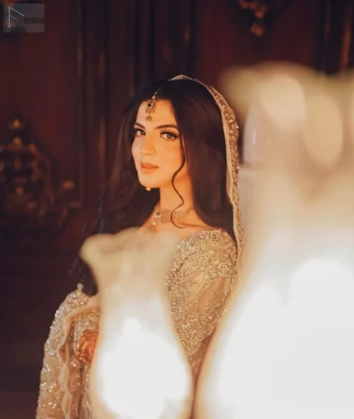 The scalloped edges of the dupatta add an enchanting detail, trailing behind you like a whisper of elegance.