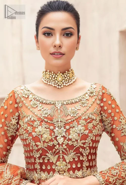 Full sleeves and a sweeping long-length lehenga crafted from luxurious organza complete this masterpiece, making you feel like a queen