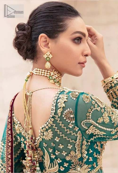 Complete the ensemble with a dupatta adorned with intricate embroidery, featuring scattered floral motifs and finished with four-sided maroon appliqué