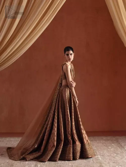 The Finished Edge: Detail of the hand-finished edges on the bronze organza dupatta and silk lehenga.